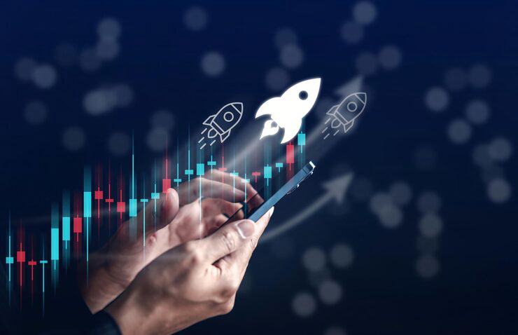 businessman hold smart phone with rocket launch investment growth planning staring corporate business start up