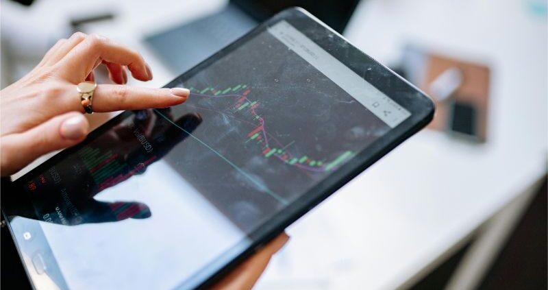 Woman Holding a Black Tablet Computer